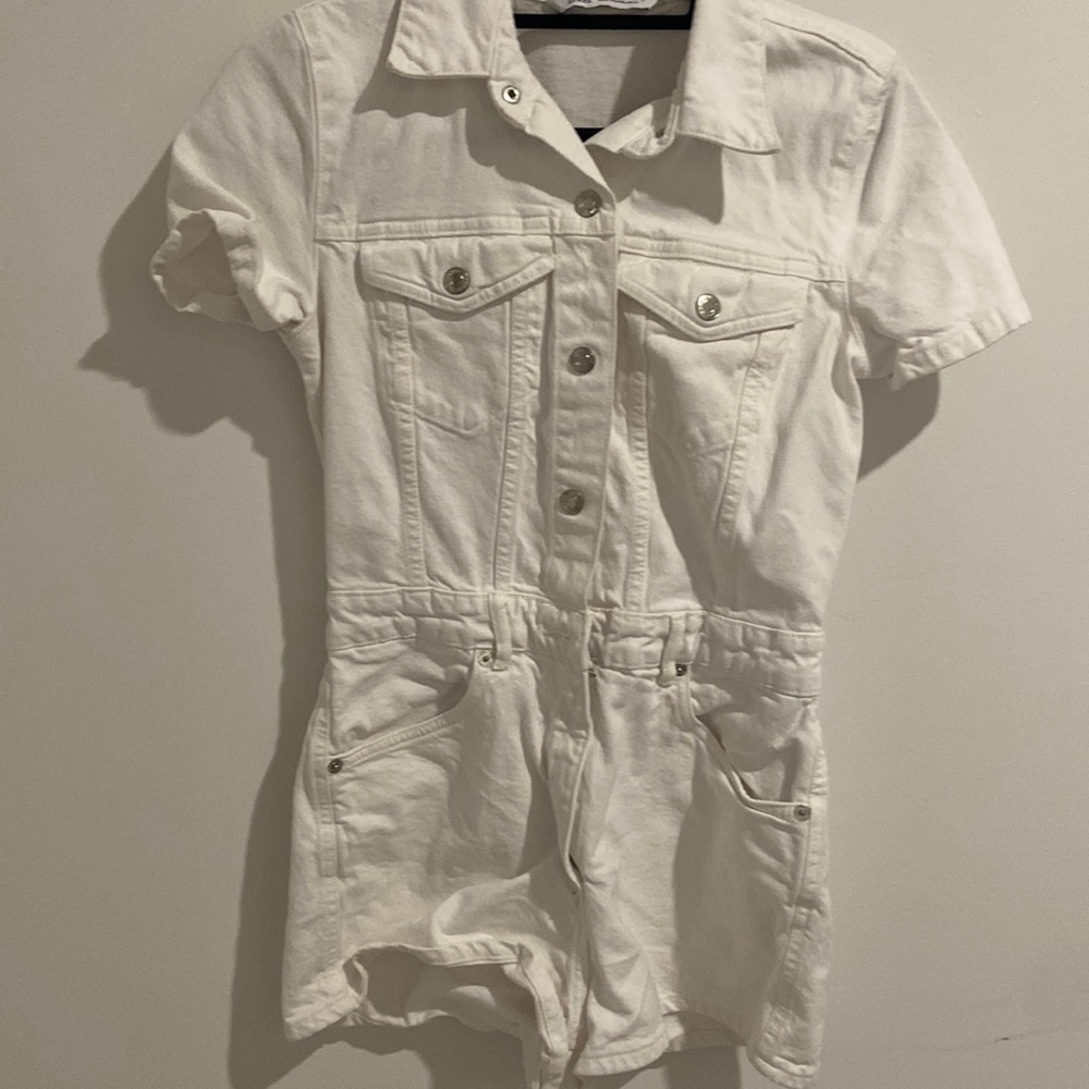 Denim romper with a button front from Zara.
